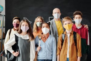Teacher with students wearing masks