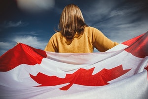woman holding canadian flag