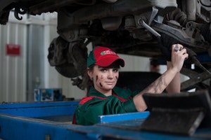 Car mechanic lady smiling