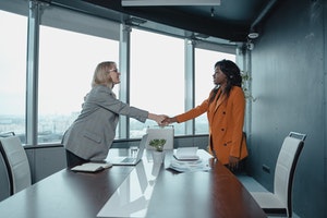 women shaking hands