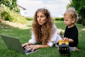 Mother with child signing up for immigration