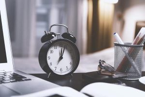 Clock and laptop