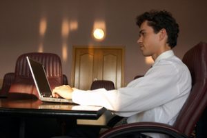 Tech worker on laptop in Canada