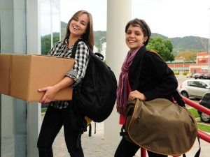 College students entering their dorms